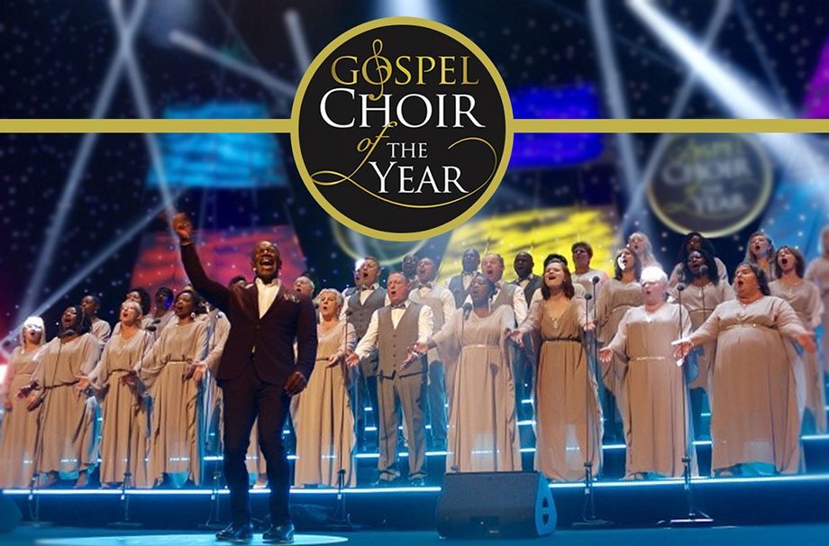 Songs of Praise choir performing on stage in Great Hall