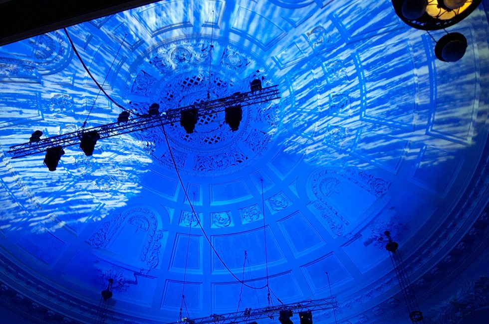 Projection mapping illuminating domed ceiling in Great Hall