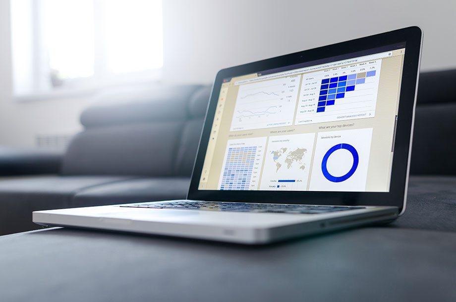 Stock image of laptop presenting graphs