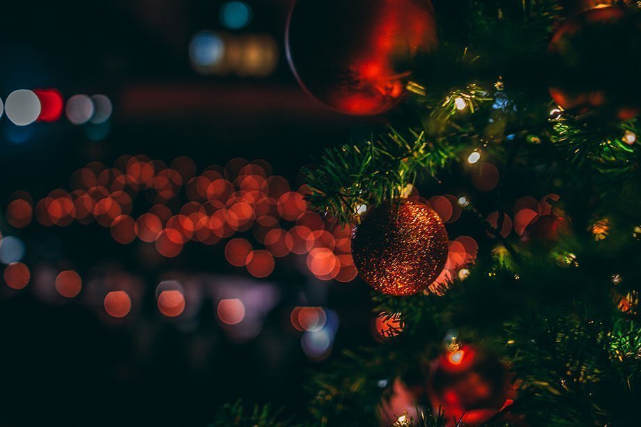 Stock image of red and glittery baubles on a Christmas tree