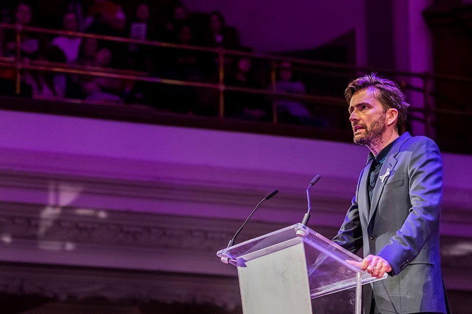 David Tennant speaking on stage at the #March4Women summit at Central Hall Westminster