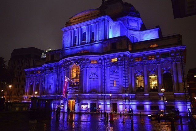 Central Hall Westminster lit up in blue lights at night